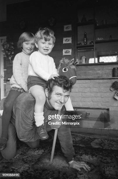 Liverpool goalkeeper Tommy Lawrence playing with his young son Stephen and daughter Traced at the family home. February 1970.