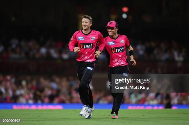 Joe Denly of the Sixers celebrates with Johan Botha after taking the wicket of Seb Gotch of the Stars during the Big Bash League match between the...