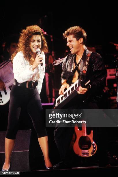 Gloria Estefan and Jim Trompeter performing with Miami Sound Machine at Radio City Music Hall in New York City on July 25, 1988.