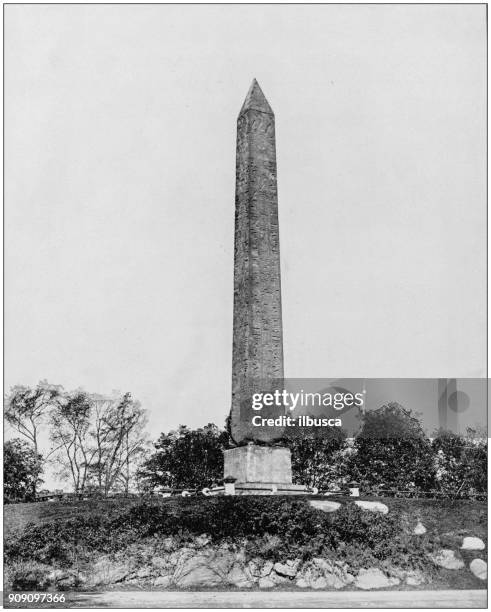 antique photograph of world's famous sites: obelisk, central park, new york - obelisk stock illustrations