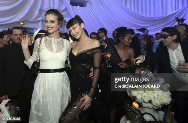 Czech model Eva Herzigova and US model Bella Hadid pose as they attend the Dior Ball in the grounds of the Rodin Museum in Paris, following the...