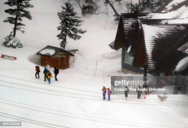 Skiers are rescued from the ropeway summit station where they fled to after the eruption on January 23, 2018 in Kusatsu, Gunma, Japan....