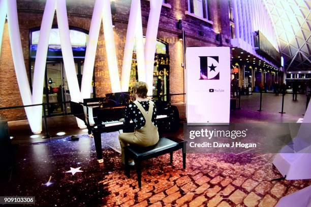 London commuters transported back to 1970's LA with the Elton John augmented reality experience supported by YouTube at Kings Cross Station on...