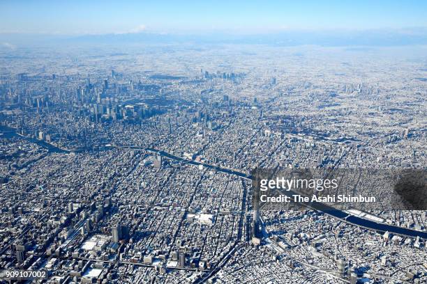 In this aerial image, snow covered Tokyo is seen on January 23, 2018 in Tokyo, Japan. The snowstorm affected traffic and public transport in the...