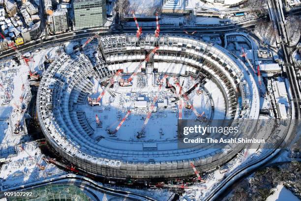 In this aerial image, snow covered new National Stadium construction site is seen on January 23, 2018 in Tokyo, Japan. The snowstorm affected traffic...