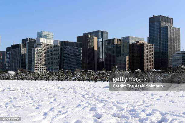 Snow covered Otemachi business area is seen on January 23, 2018 in Tokyo, Japan. The snowstorm affected traffic and public transport in the capital...