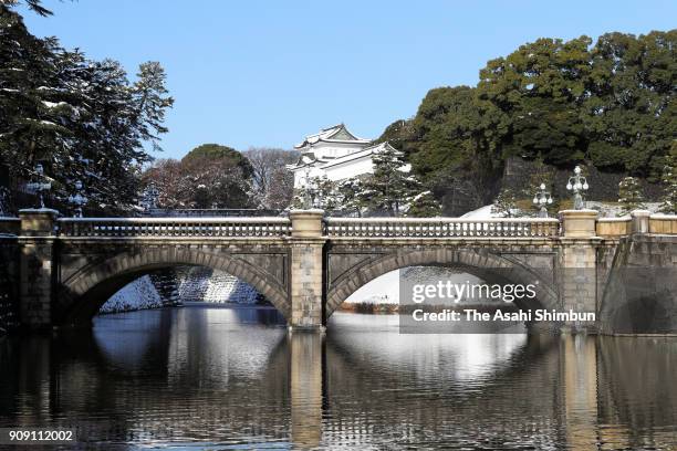 Snow covered Nijubashi Bridge of the Imperial Palace is seen on January 23, 2018 in Tokyo, Japan. The snowstorm affected traffic and public transport...