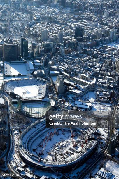 In this aerial image, snow covered new National Stadium construction site is seen on January 23, 2018 in Tokyo, Japan. The snowstorm affected traffic...