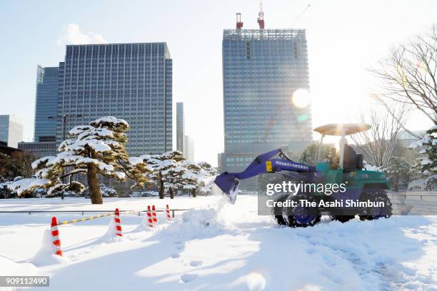 Snow remover is deployed at the Imperial Palace on January 23, 2018 in Tokyo, Japan. The snowstorm affected traffic and public transport in the...