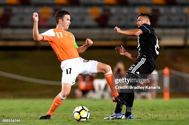 Matthew McKay of the Roar and Ceres Negros player Arnie Pasinabo challenge for the ball during the AFC Asian Champions League Preliminary Stage match...