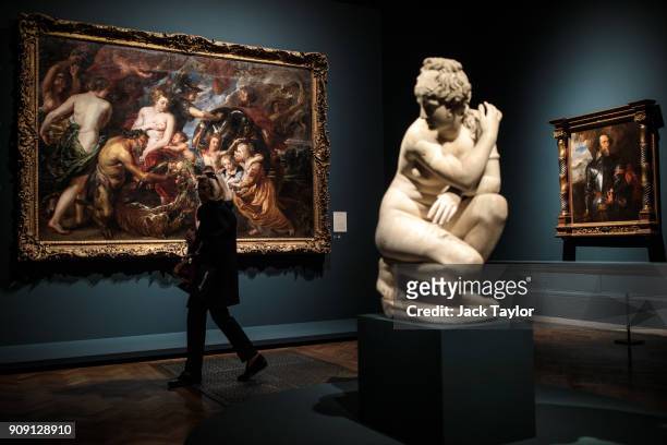 Visitor walks past 'Minerva Protects Pax from Mars ', 1629-30, by Peter Rubens as the sculpture Aphrodite or 'Crouching Venus' from the second...