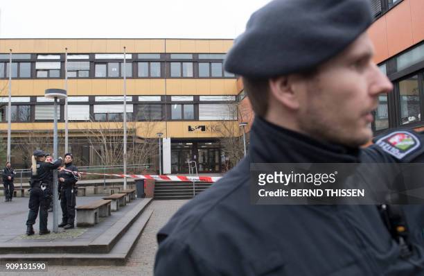Police cordon off the Kaethe-Kollwitz school on January 23 in Luenen, western Germany, after they arrested a 15-year-old teen who allegedly killed a...