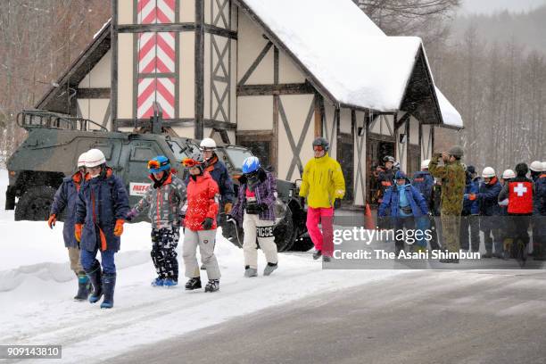 Skiers rescued from the summit by a Self-Defense Force helicopter are seen on January 23, 2018 in Kusatsu, Gunma, Japan. Kusatsu-Shirane, a...