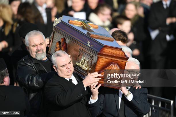 The coffin of Dolores O'Riordan is carried out of St Ailbe's parish church in Ballybricken after the funeral on January 23, 2018 in Limerick,...