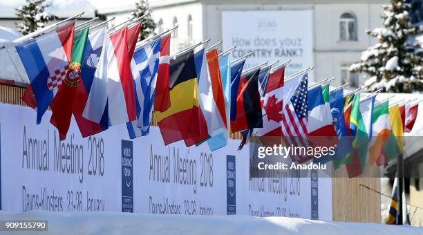 National flags are seen at the congress hall where the Annual Meeting of the 48th World Economic Forum held in, on January 23, 2018 in Davos,...