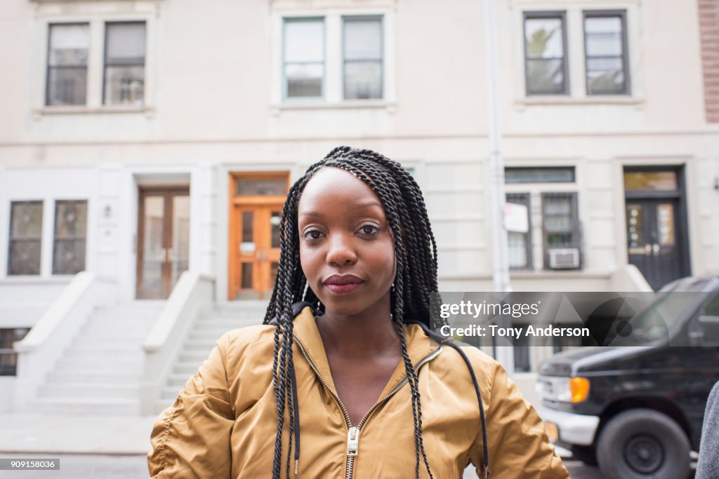 Young young woman in her city neighborhood