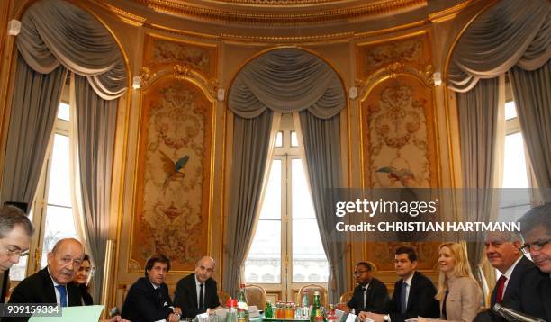 Secretary of State Rex Tillerson and French Foreign Affairs Minister Jean-Yves Le Drian attend a meeting with diplomats from 29 countries in Paris,...