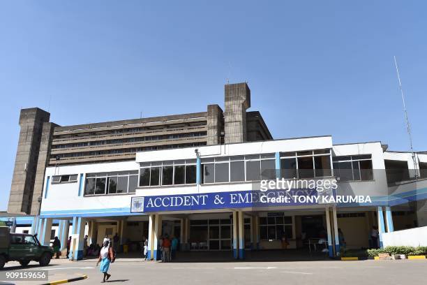 People stand in front of the accident and emergency wing of Kenya's oldest hospital, Kenyatta National Hospital on January 23, 2018 in Nairobi. KNH...