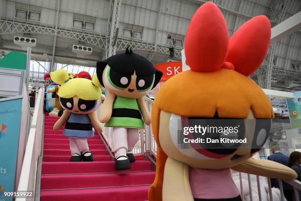 Life size cartoon characters make their way to a photocall during the 2018 London Toy Fair at Olympia Exhibition Centre on January 23, 2018 in...