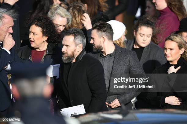 The Cranberries band members Mike Hogan and Noel Hogan stand outside St Ailbe's parish church in Ballybricken after Dolores O'Riordan's funeral on...