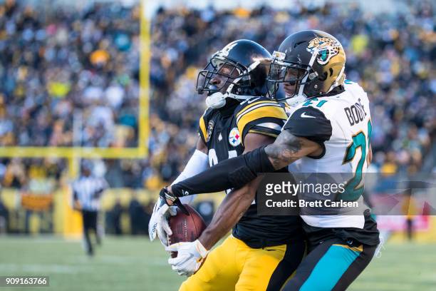 Antonio Brown of the Pittsburgh Steelers makes a catch while being defended by A.J. Bouye of the Jacksonville Jaguars for a 43 yard touchdown...