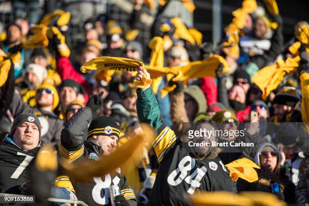 Pittsburgh Steelers fans waive terrible towels during the AFC Divisional Playoff game against the Jacksonville Jaguars at Heinz Field on January 14,...