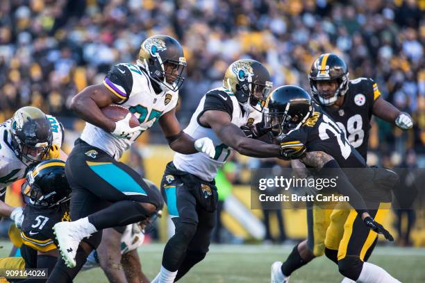 Leonard Fournette of the Jacksonville Jaguars carries the ball during the second half of the AFC Divisional Playoff game against the Pittsburgh...