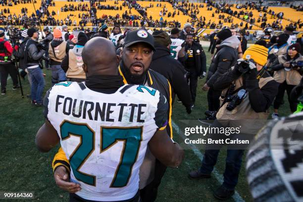 Head coach Mike Tomlin of the Pittsburgh Steelers and Leonard Fournette of the Jacksonville Jaguars speak after the AFC Divisional Playoff game at...