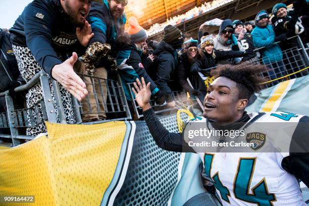 Myles Jack of the Jacksonville Jaguars high fives fans after the AFC Divisional Playoff game against the Pittsburgh Steelers at Heinz Field on...