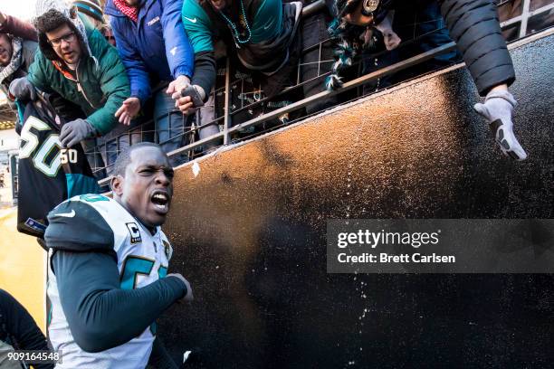 Telvin Smith of the Jacksonville Jaguars celebrates as he exits the field after the AFC Divisional Playoff game against the Pittsburgh Steelers at...
