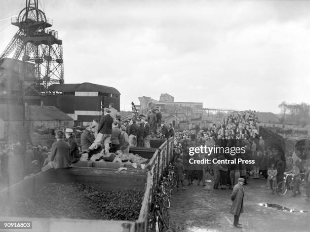 Local people gathered at the pithead after an underground explosion at Gresford Colliery near Wrexham in Wales, 22nd September 1934. 266 men were...