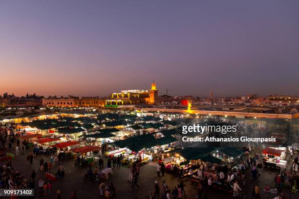 Panoramic view of Jamaa el Fna square during the sunset looking toward Cafe Argana and the covered souq on January 04, 2018 in Marrakesh, Morocco....