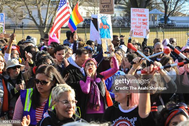 People gather at the Lincoln Memorial reflecting pool to rally before the Women's March on January 20, 2018 in Washington, D.C. Across the nation,...