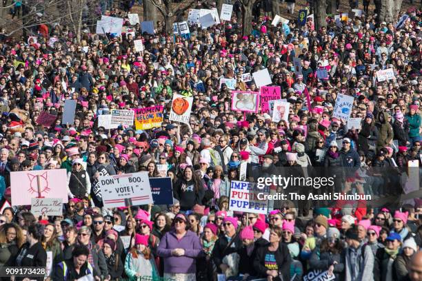 People gather at the Lincoln Memorial reflecting pool to rally before the Women's March on January 20, 2018 in Washington, D.C. Across the nation,...