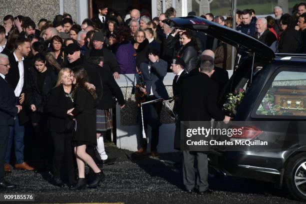 Eileen O'Riordan, mother to the late Dolores O'Riordan hugs Molly O'Riordan, daughter of Dolores O'Riordan outside St Ailbe's Church, Ballybricken on...