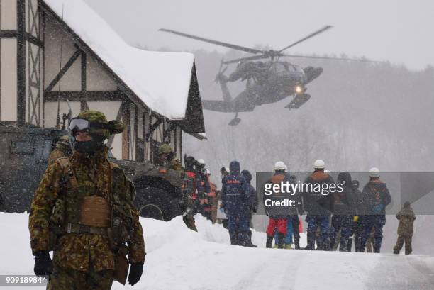 Helicopter from Japan's Self-Defence Force is seen at a ski resort during a rescue operation after the volcanic eruption of Mount Kusatsu-Shirane in...