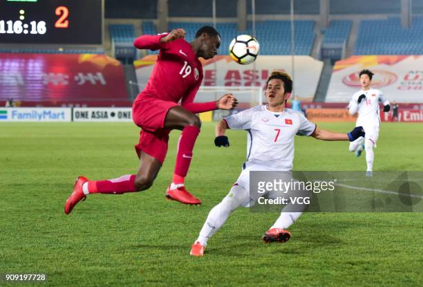 Almoez Ali of Qatar and Nguyen Phong Hong Duy of Vietnam compete for the ball during the AFC U-23 Championship semi-final match between Qatar and...