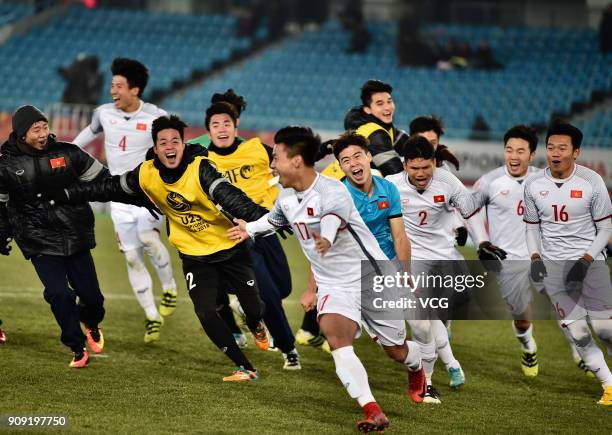 Players of Vietnam celebrate after winning the AFC U-23 Championship semi-final match between Qatar and Vietnam at Changzhou Olympic Sports Center on...