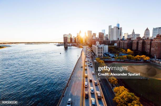 new york cityscape elevated view during sunset, new york state, usa - car road sunset fotografías e imágenes de stock