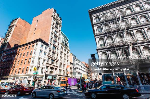 streets of soho, new york city, usa - soho new york stockfoto's en -beelden
