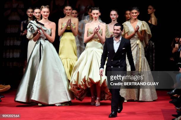 French fashion designer Alexis Mabille acknowledges the audience at the end of the 2018 spring/summer Haute Couture collection fashion show on...