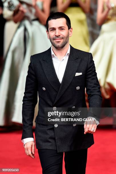 French fashion designer Alexis Mabille acknowledges the audience at the end of the 2018 spring/summer Haute Couture collection fashion show on...