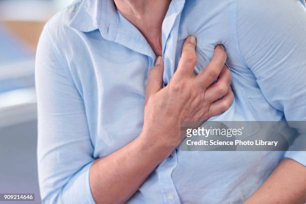 woman clutching her chest, cropped view - hjärtattack bildbanksfoton och bilder