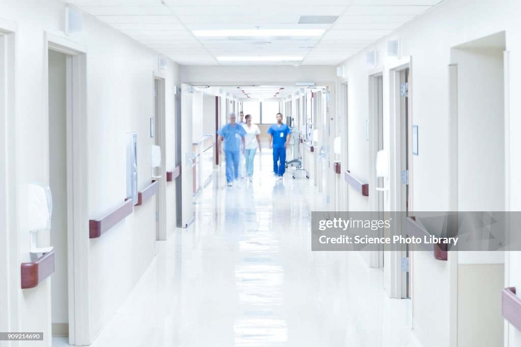 Doctors walking down hospital corridor