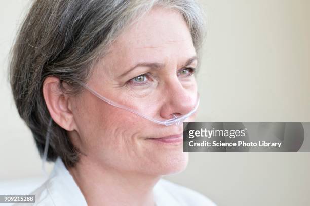 female patient with nasal cannula - nasal cannula foto e immagini stock