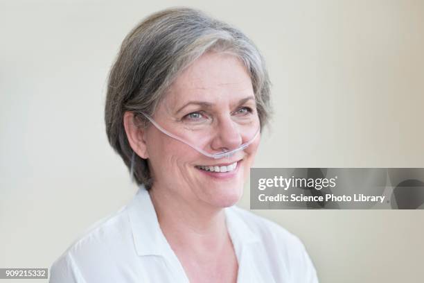 female patient with nasal cannula - oxygen stock pictures, royalty-free photos & images