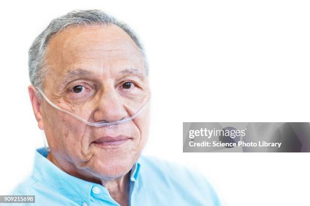 male patient with nasal cannula - oxígeno fenómeno natural fotografías e imágenes de stock