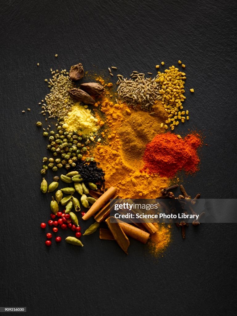 Dried spices on black slate