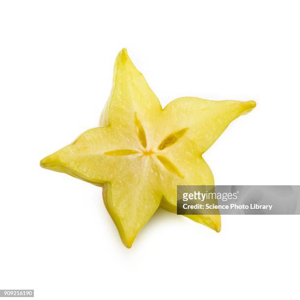 half a starfruit - carambola stock pictures, royalty-free photos & images