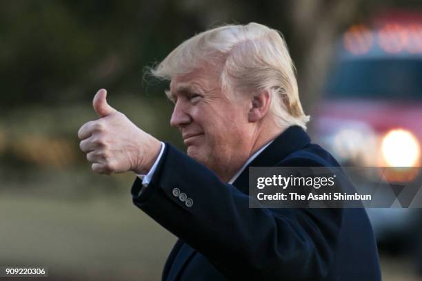 President Donald Trump thumbs up as he returned to the White House on January 18, 2018 in Washington, DC. President Trump returned from a trip to...
